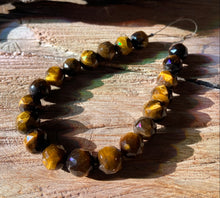 Load image into Gallery viewer, 10mm Faceted Tiger Eye beads
