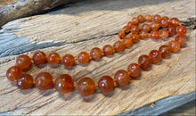 Load image into Gallery viewer, Graduated Carved Carnelian beads

