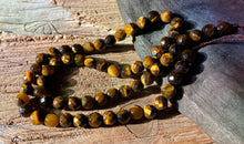 Load image into Gallery viewer, 6mm Faceted Tiger Eye beads
