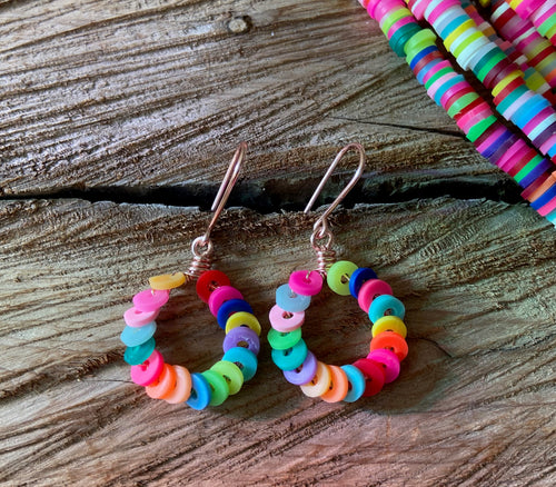 Upcycled rubber beads in a variety of bright, neonshades wrapped on rose gold 1/2
